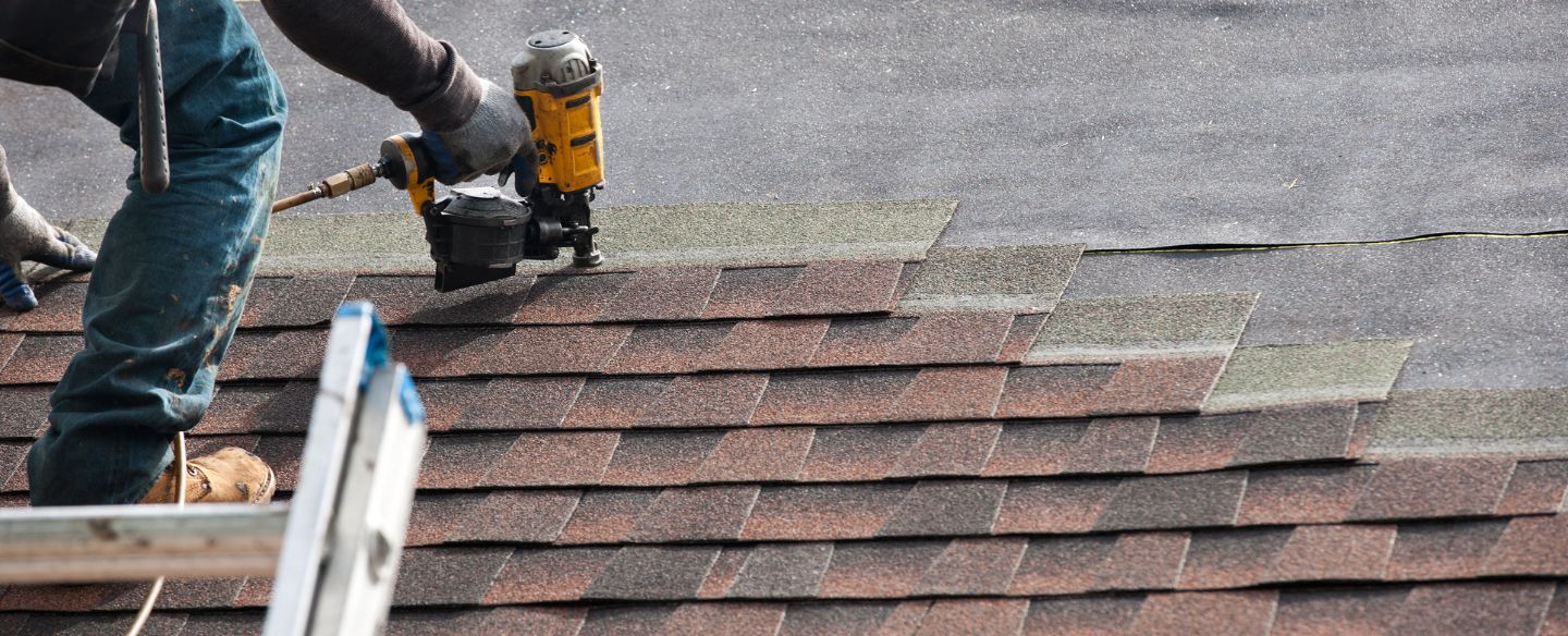roofer installing new roof on house louisburg ks
